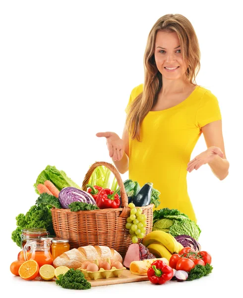 Young woman with assorted grocery products isolated on white Royalty Free Stock Photos