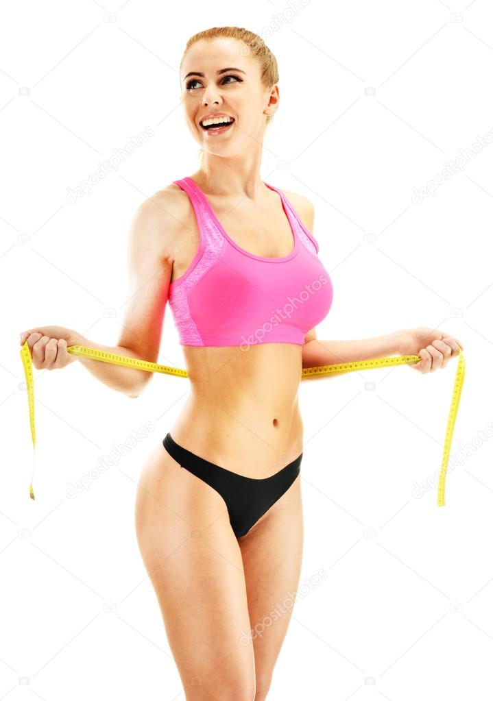 Sexy young woman measuring herself. Weight loss