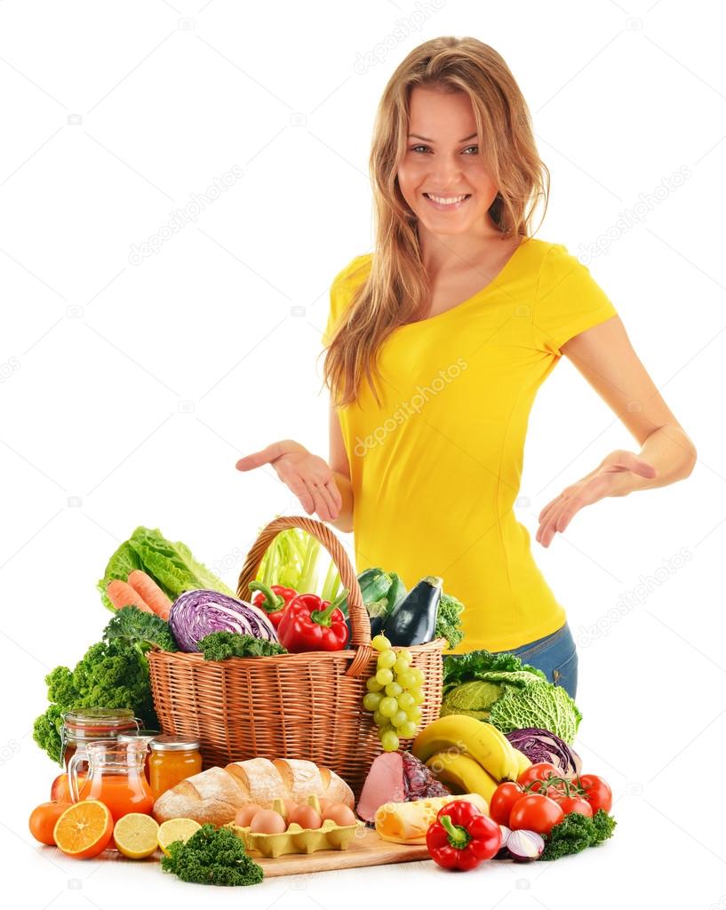 Young woman with assorted grocery products isolated on white