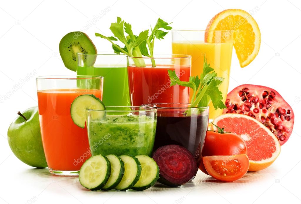 Glasses with fresh organic vegetable and fruit juices on white