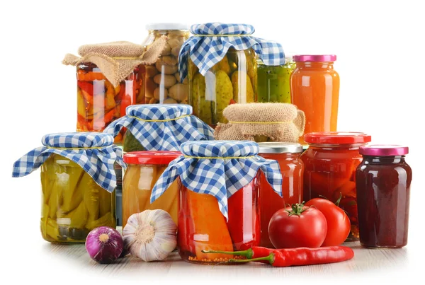 Composition with jars of pickled vegetables. Marinated food — Stock Image Composition with jars of pickled vegetables. Marinated food Stock Photo