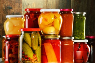 Jars with pickled vegetables, fruity compotes and jams isolated  clipart