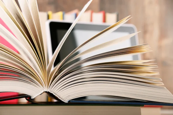 Composition with books and tablet computer on the table — Stock Photo, Image