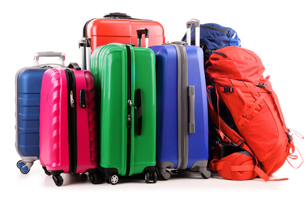 Suitcases and rucksack isolated on white