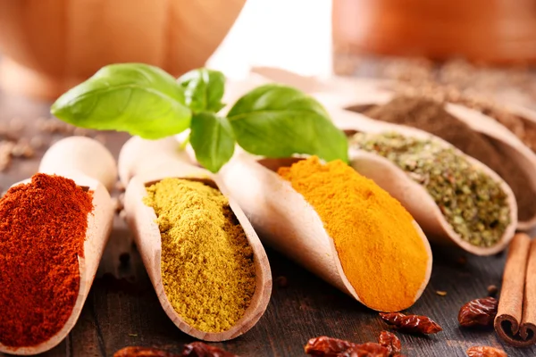 Variety of spices on kitchen table — Stock Photo, Image