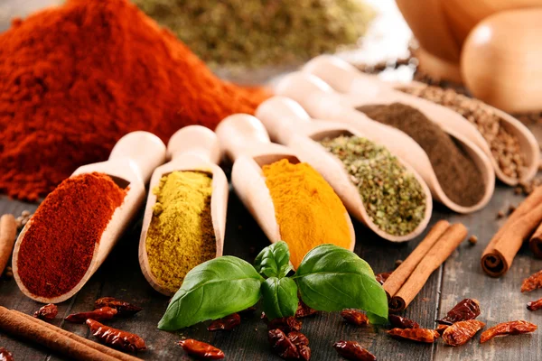 Variety of spices on kitchen table — Stock Photo, Image