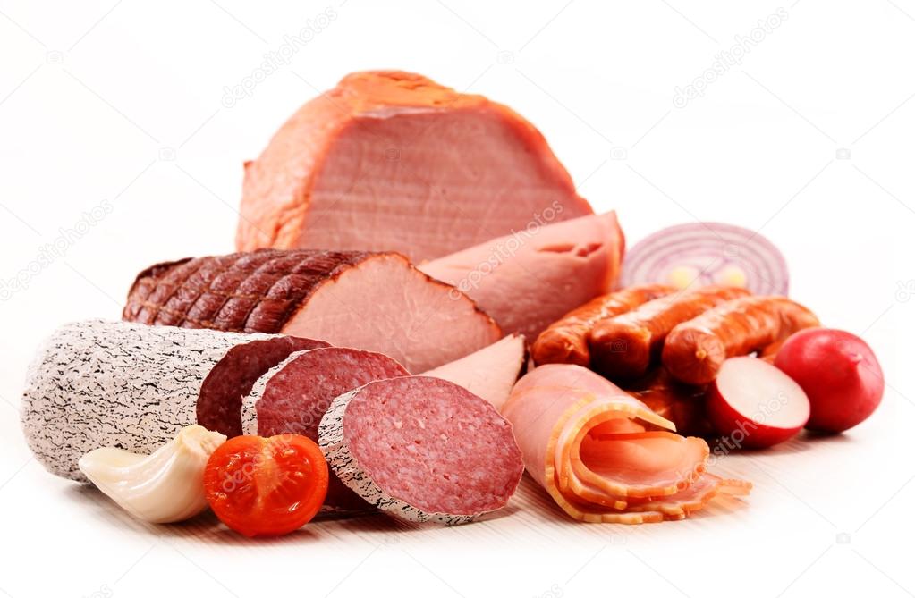 Meat products including ham and sausages isolated on white