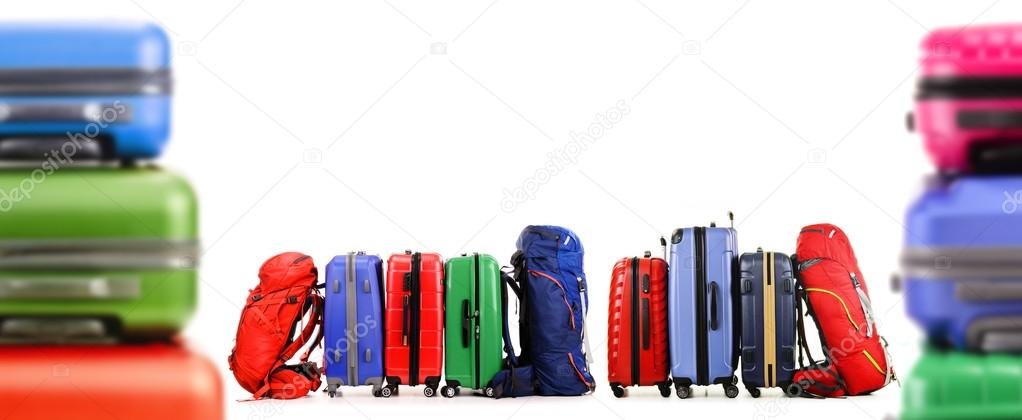 Suitcases and backpacks isolated on white background