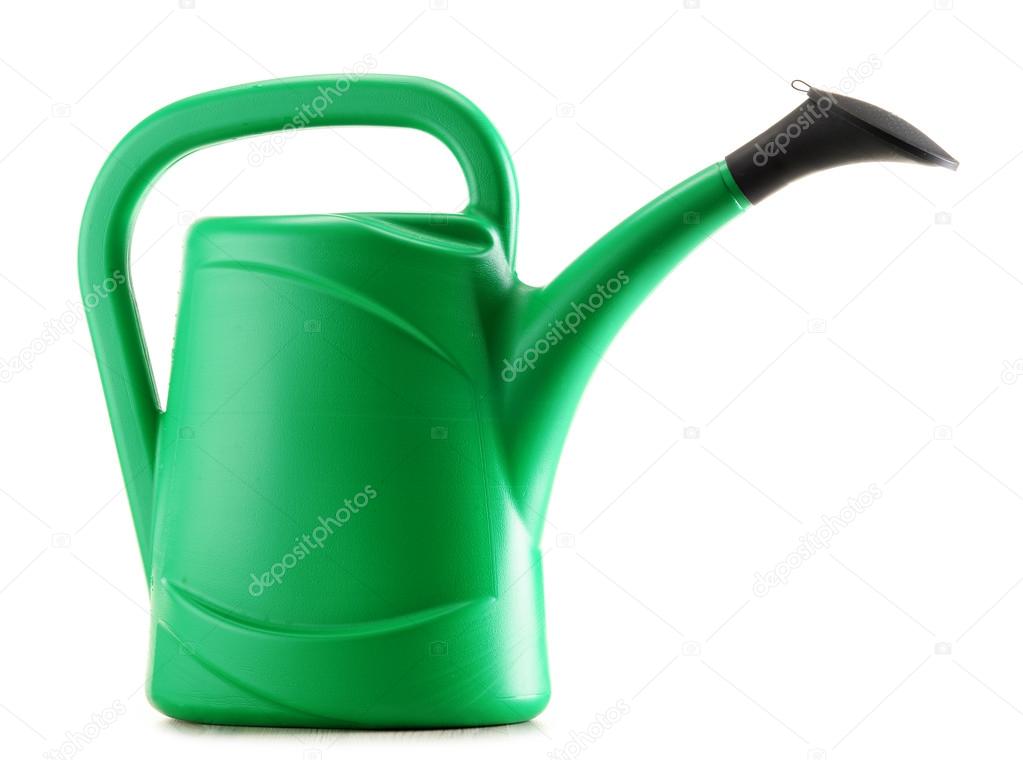 Green plastic watering can isolated on white