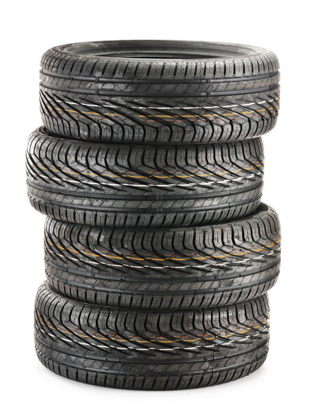 Four new black tires isolated on white