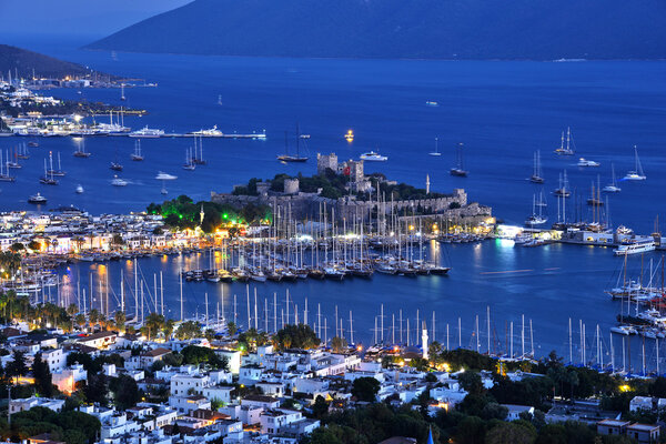 View of Bodrum harbor and Castle of St. Peter after sunset