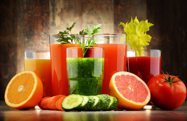 Glasses with fresh organic vegetable and fruit juices