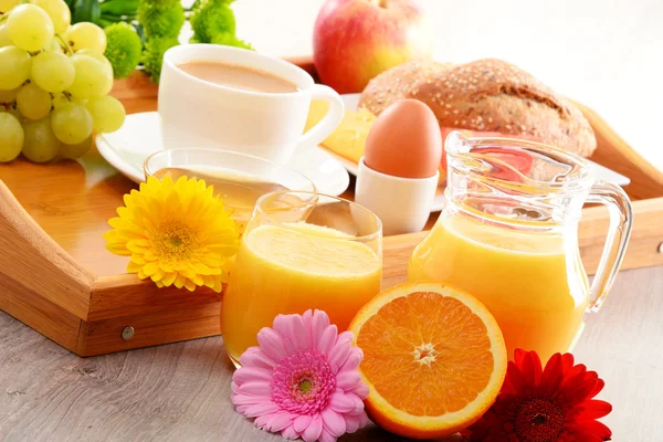 Breakfast on tray served with coffee, juice, egg, and rolls — Stock Photo, Image