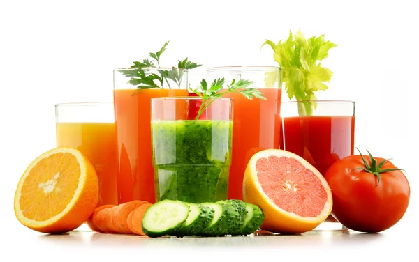 Glasses with fresh organic vegetable and fruit juices on white — Stock Photo, Image