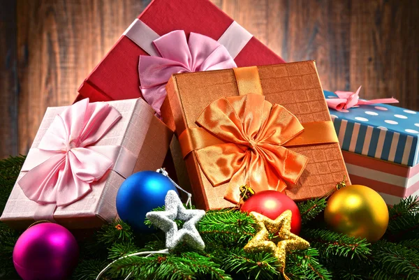 Colorful gift boxes and christmas tree — Stock Photo, Image