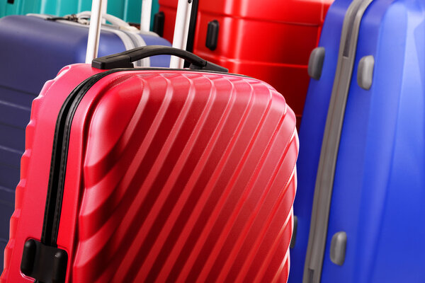 Composition with colorful travel suitcases