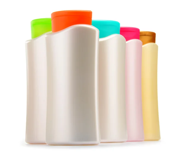 Plastové lahve tělo péče a kosmetických výrobků nad bílá — Stock fotografie