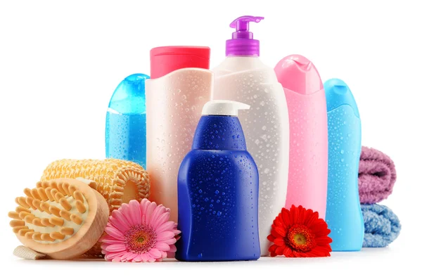 Plastic bottles of body care and beauty products over white — Stock Photo, Image