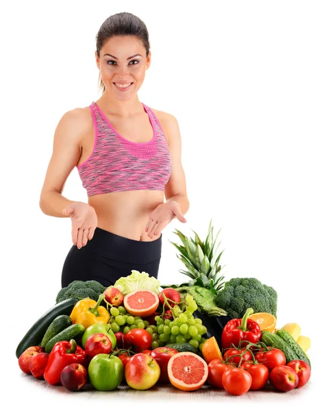 Young woman with variety of organic vegetables and fruits — Stock Photo, Image