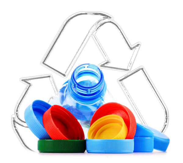 Recycling sign with plastic bottles and caps