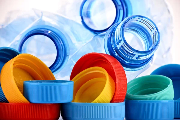 Composition with plastic bottles and caps — Stock Photo, Image