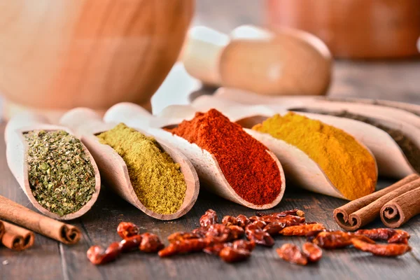 Variety of spices on kitchen table — Stock Photo, Image