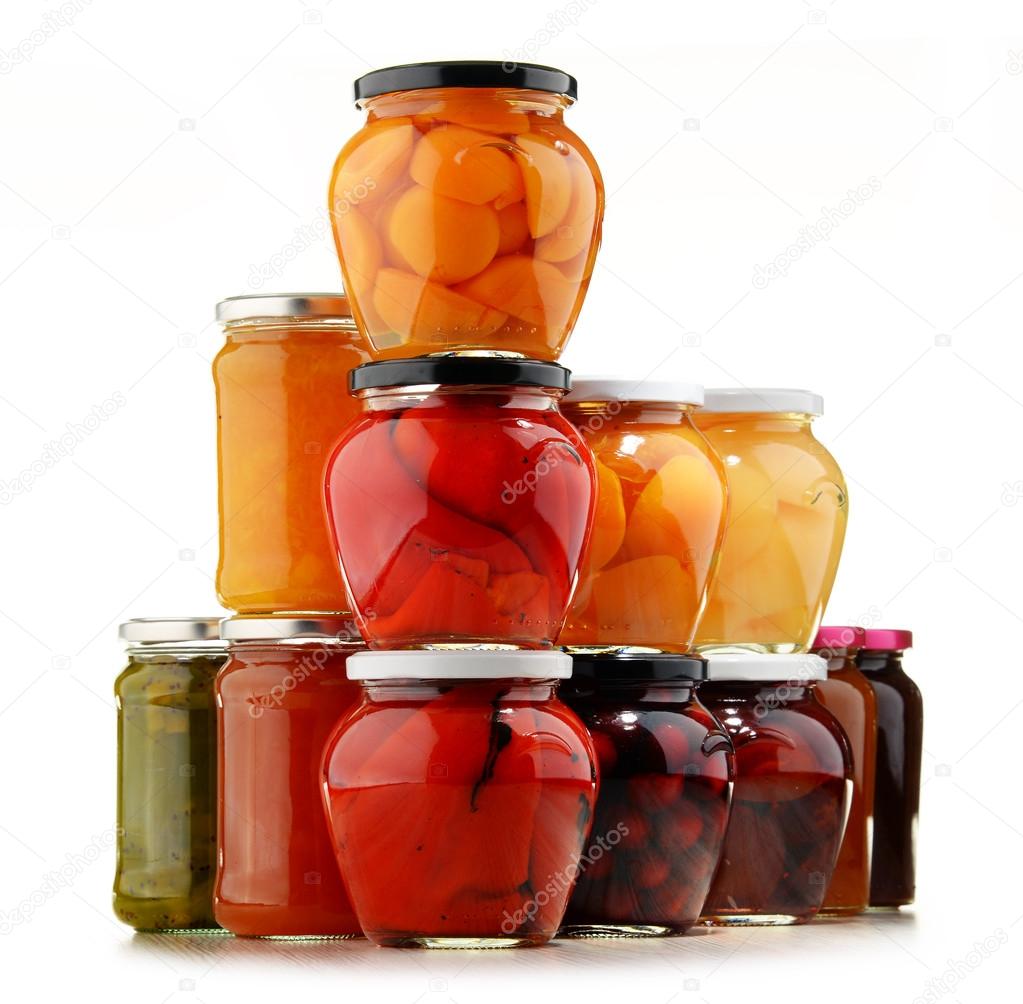 Jars with fruity compotes and jams. Preserved fruits