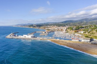 Aerial panoramic view of Arenys de Mar city at dawn. Located in El Maresme, Barcelona, Spain clipart