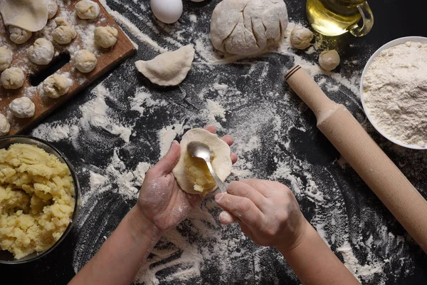 Woman Sculpts Dumplings Handmade Potatoes Black Background Shot Top Angle — Stock Photo, Image