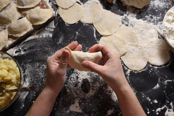Woman Sculpts Dumplings Handmade Potatoes Black Background Shot Top Angle — Stock Photo, Image