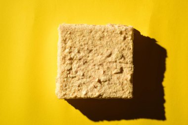 Napoleon cake shot from a high angle with hard light.