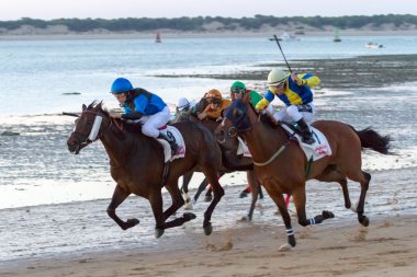 Horse race on Sanlucar of Barrameda clipart