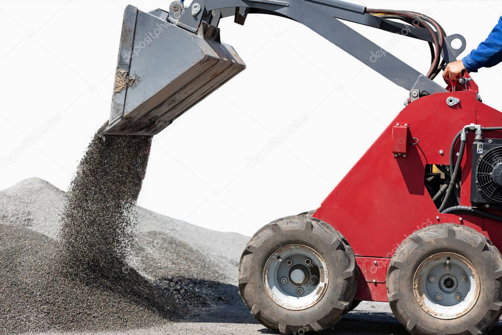 Mini wheel loader excavator unloading gravel on white background