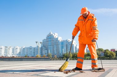 Road sweeper cleaning city street with broom tool clipart