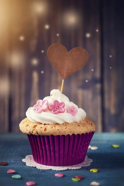 Cupcake with a cakepick — Stock Photo, Image