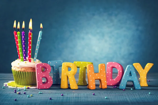 Cupcake with birthday candles — Stock Photo, Image