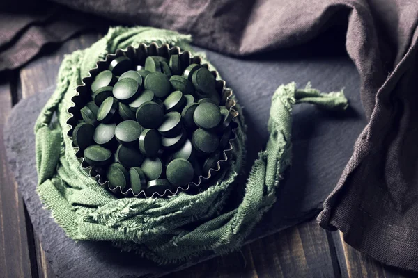 Spirulina powder in a bowl — Stock Photo, Image