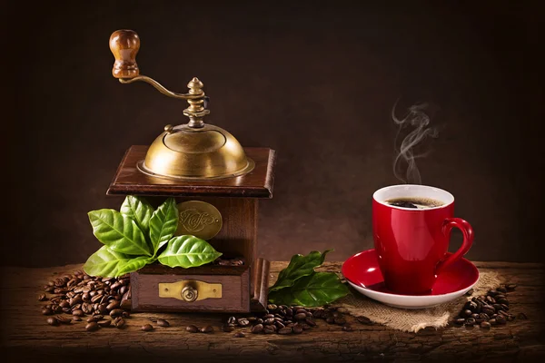 Coffee mill and a cup of coffee Stock Photo