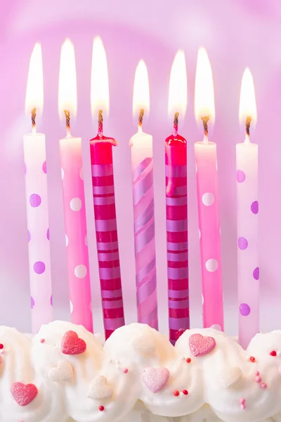 Birthday ljus på en rosa — Stockfoto