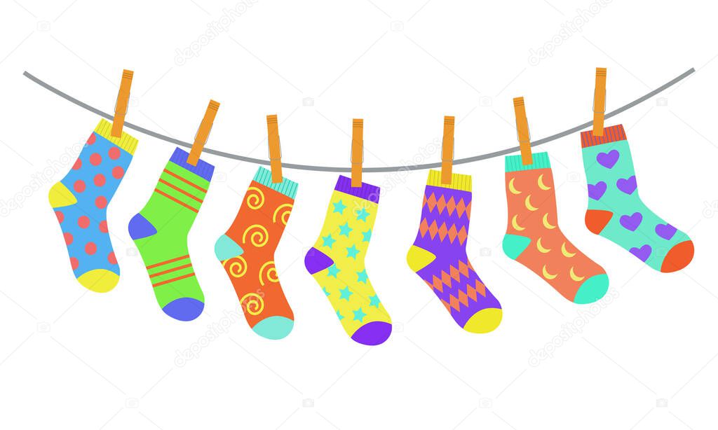 Set of colorful bright children socks drying on the clothesline. Vector illustration in flat style