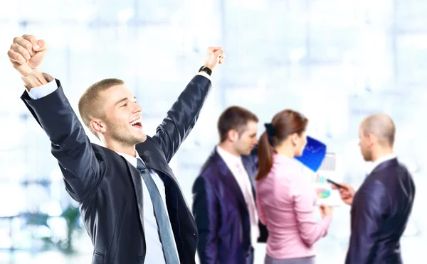 Successful business man celebrating with arms open — Stock Photo, Image