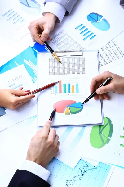 Financial paper charts and graphs on the table Royalty Free Stock Images