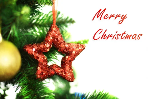 Christmas ornament red star on tree branch — Stock Photo, Image