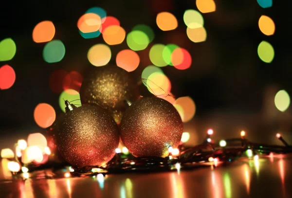 Gold  Christmas decoration over blurred background — Stock Photo, Image