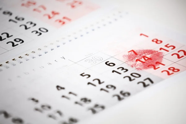 Calendar page with the red kiss on February 14 of Saint Valentines day. — Stock Photo, Image