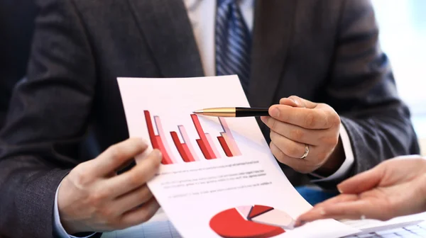 Image of human hand pointing at paper during explanation — Stock Photo, Image