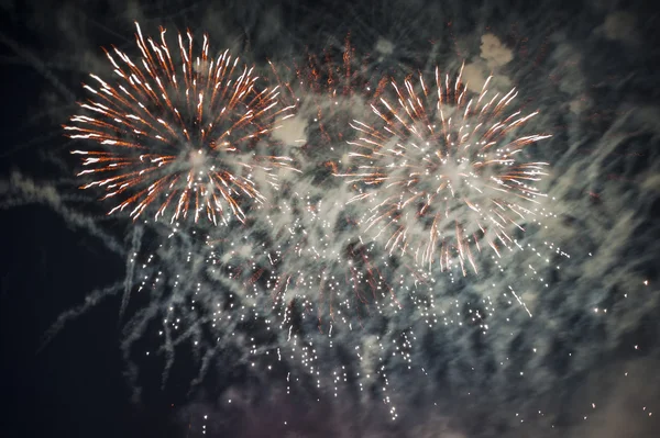 Colorful fireworks over dark sky — Stock Photo, Image