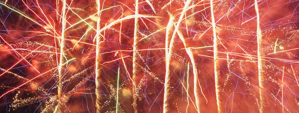 Colorful fireworks over dark sky — Stock Photo, Image