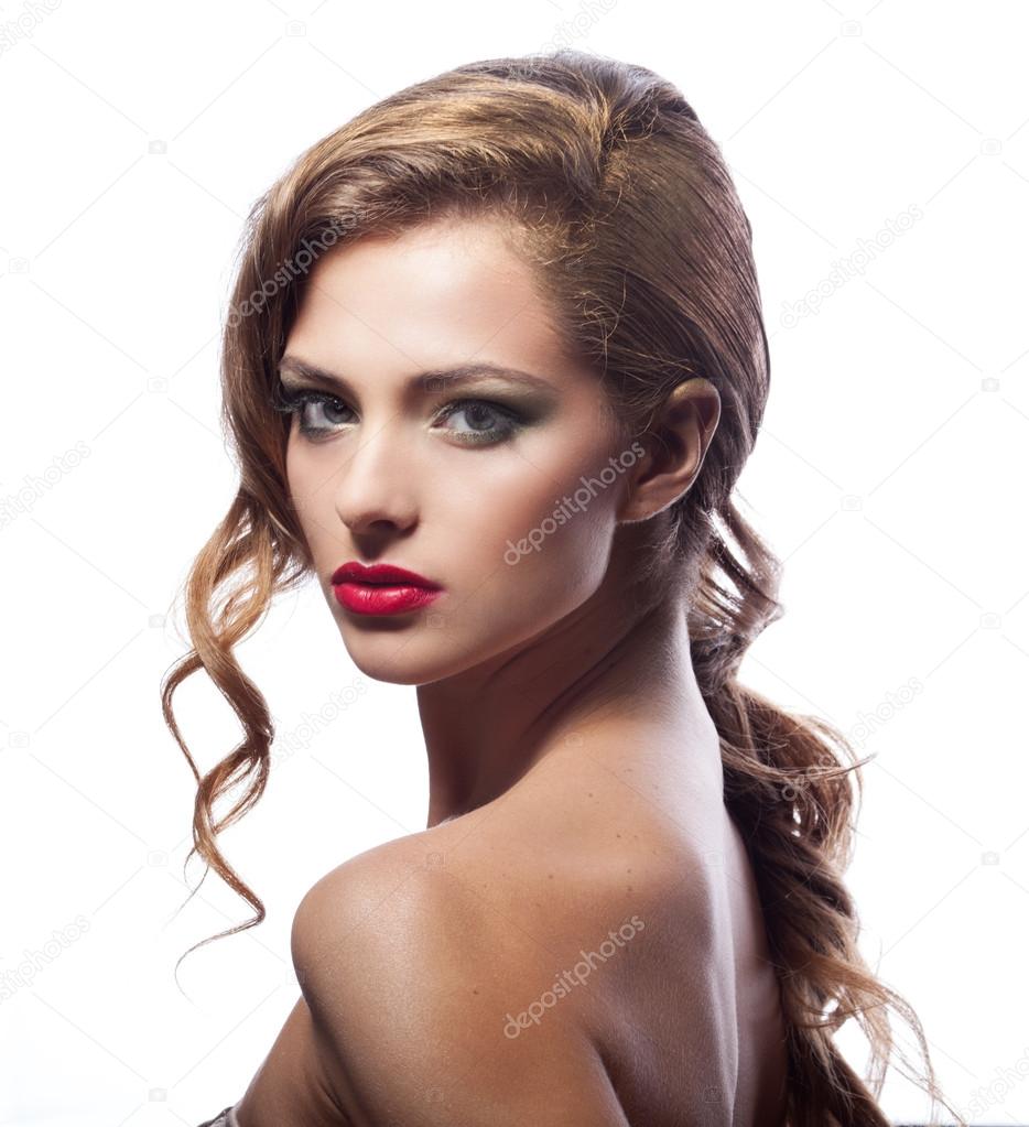 Beautiful young woman with classy makeup and hair