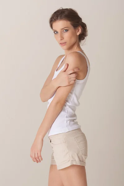 Studio portrait of a beautiful young slim woman — Stock Photo, Image